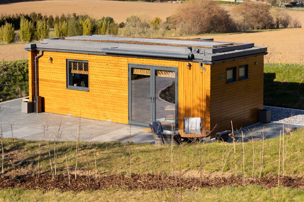 Enchanted Lodge in the Kent countryside with sedum roof and wooden cladding