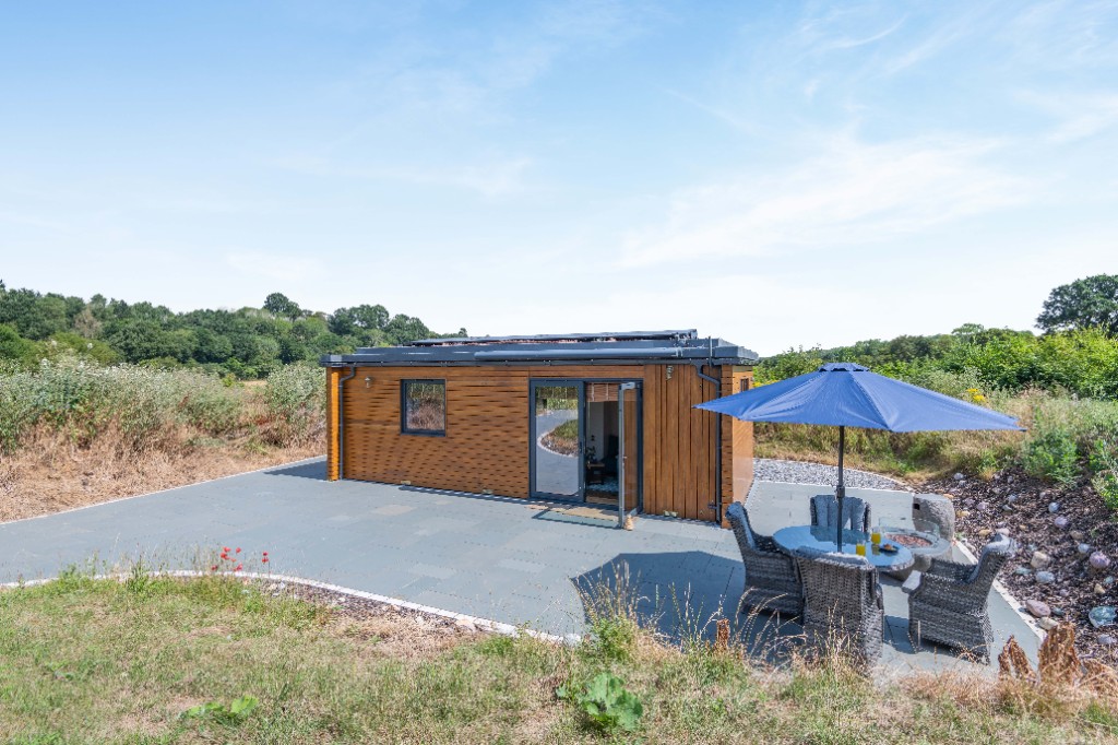 Maroc lodge among trees and rolling Kent fields